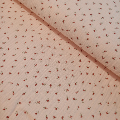 TELA MUSELINA BEBÉ FLORECITAS FONDO ROSA